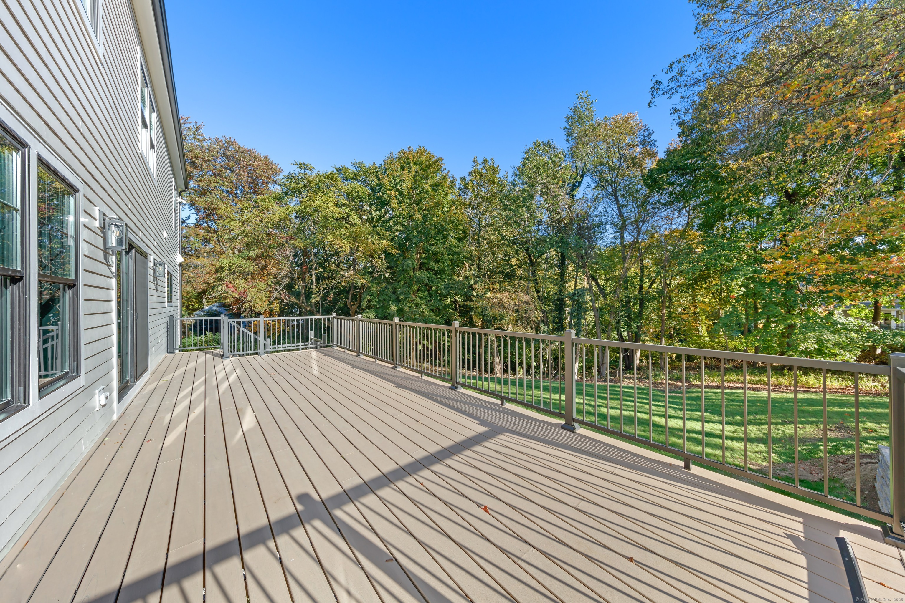 31 Gray Farms Road Stamford, CT 06905 - Photo 35 of 40 a view of a balcony with wooden floor and fence