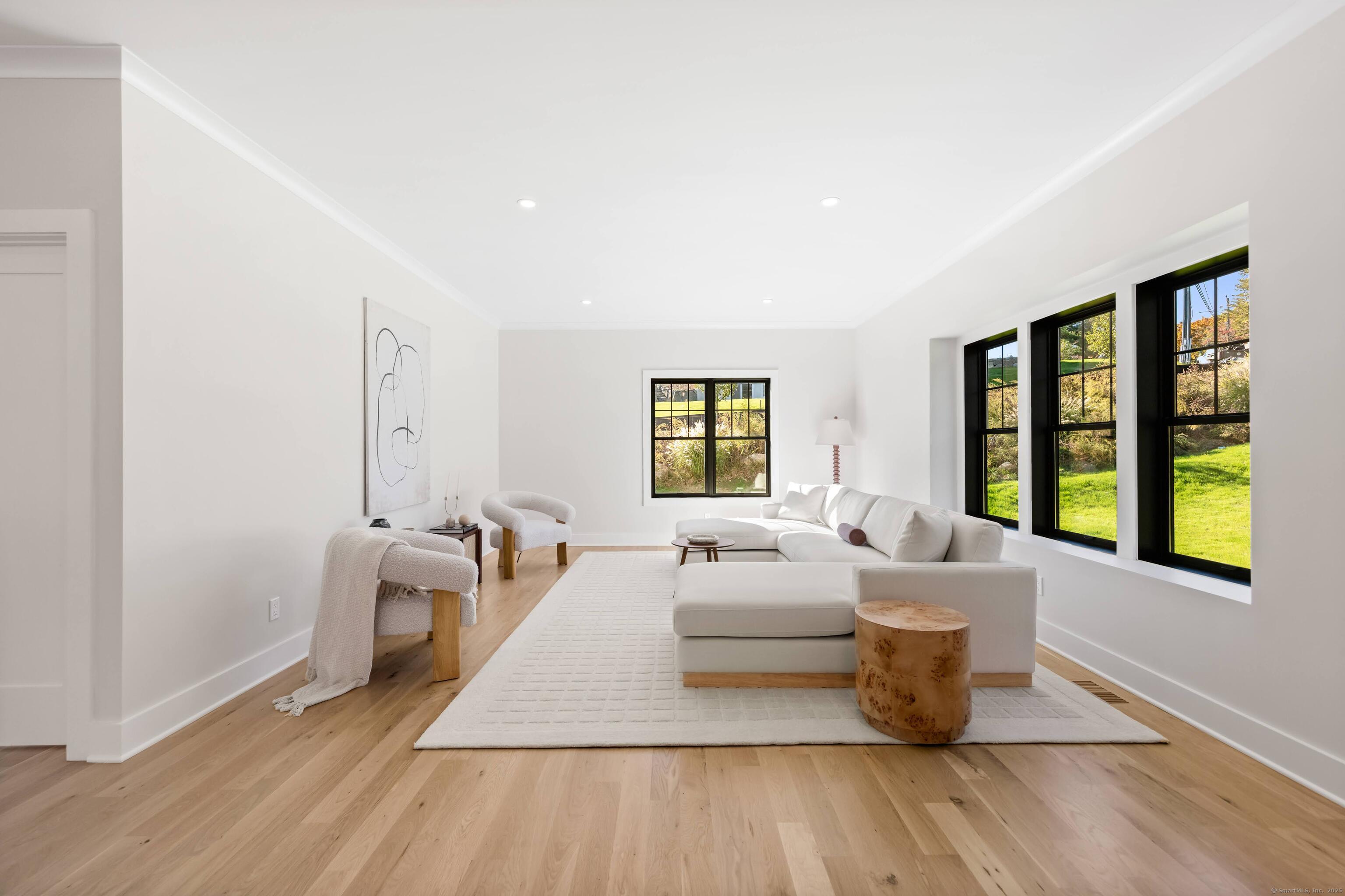 31 Gray Farms Road Stamford, CT 06905 - Photo 6 of 40 a living room with furniture and a large window