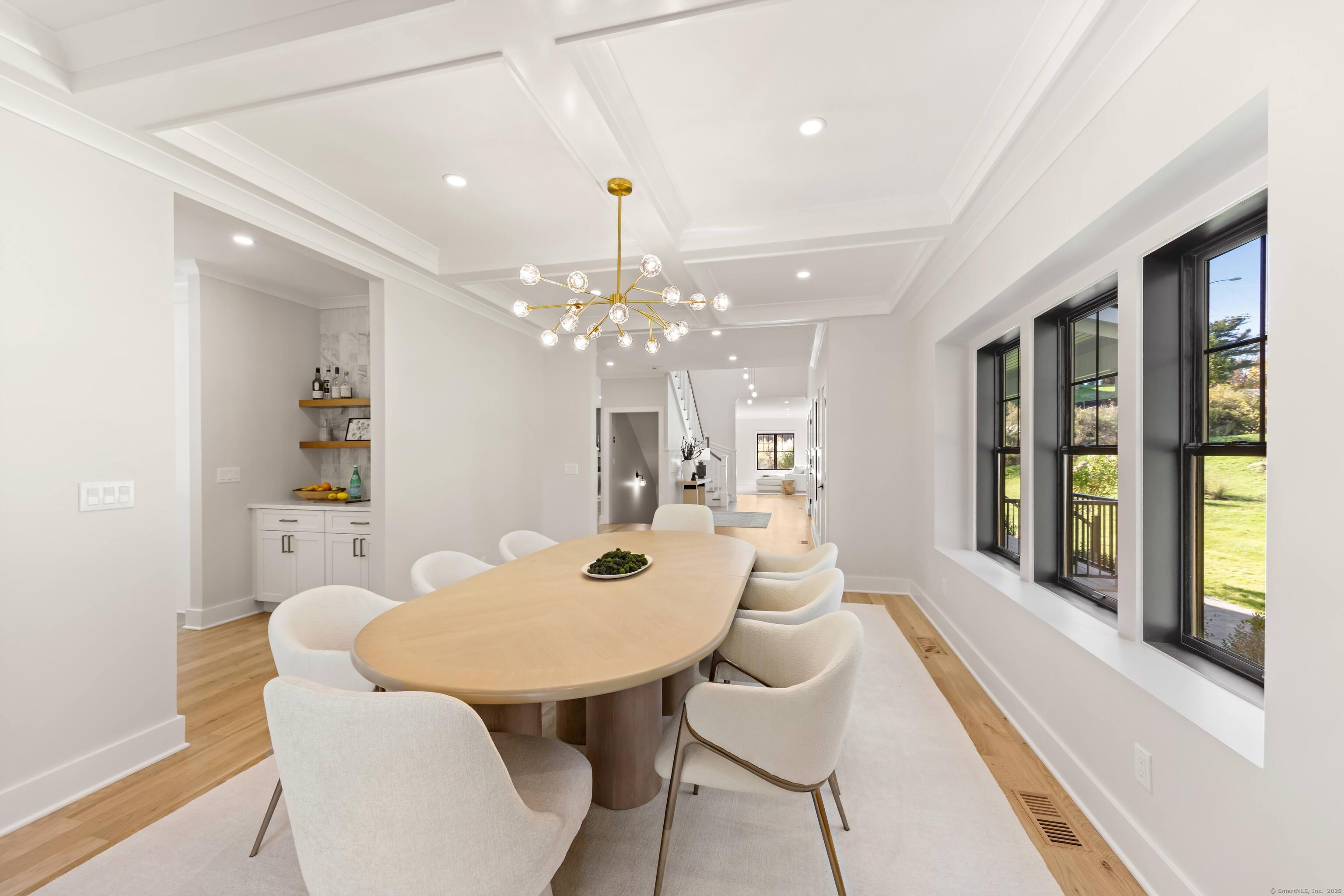 31 Gray Farms Road Stamford, CT 06905 - Photo 9 of 40 a view of a dining room with furniture and a chandelier