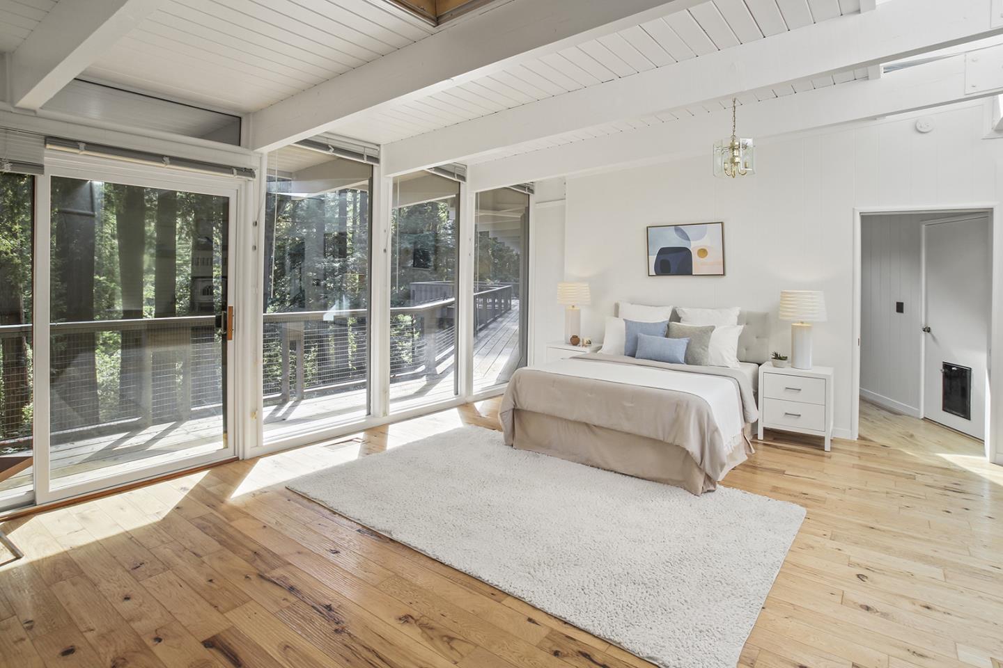 320 Grandview Drive Woodside, CA 94062 - Photo 12 of 43 a bedroom with a large bed and a large window
