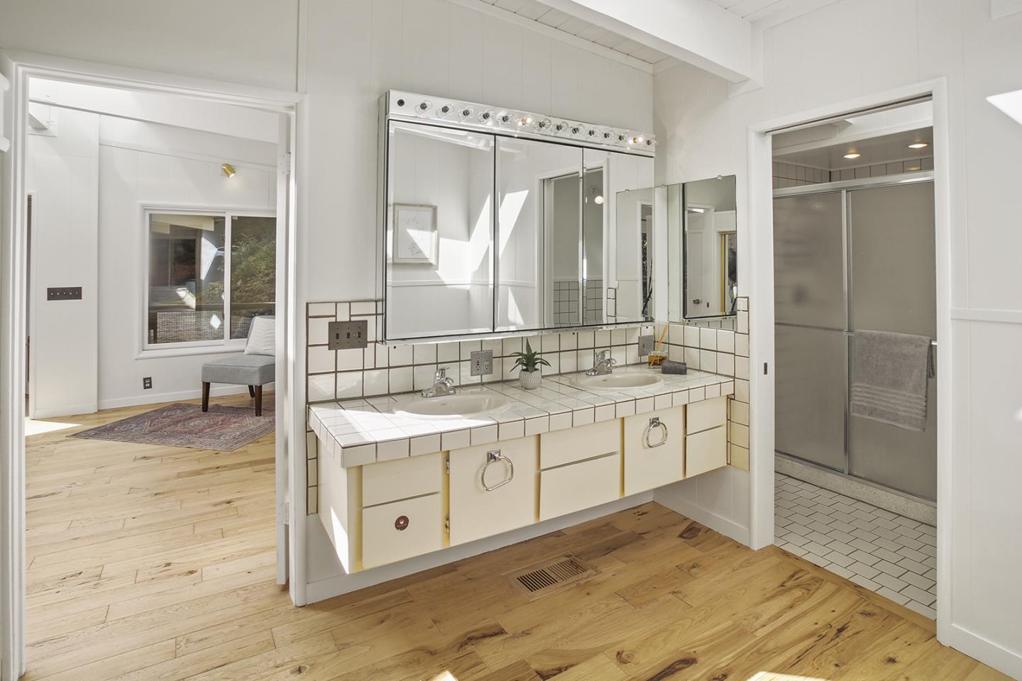 320 Grandview Drive Woodside, CA 94062 - Photo 15 of 43 a spacious bathroom with a shower sink and mirror