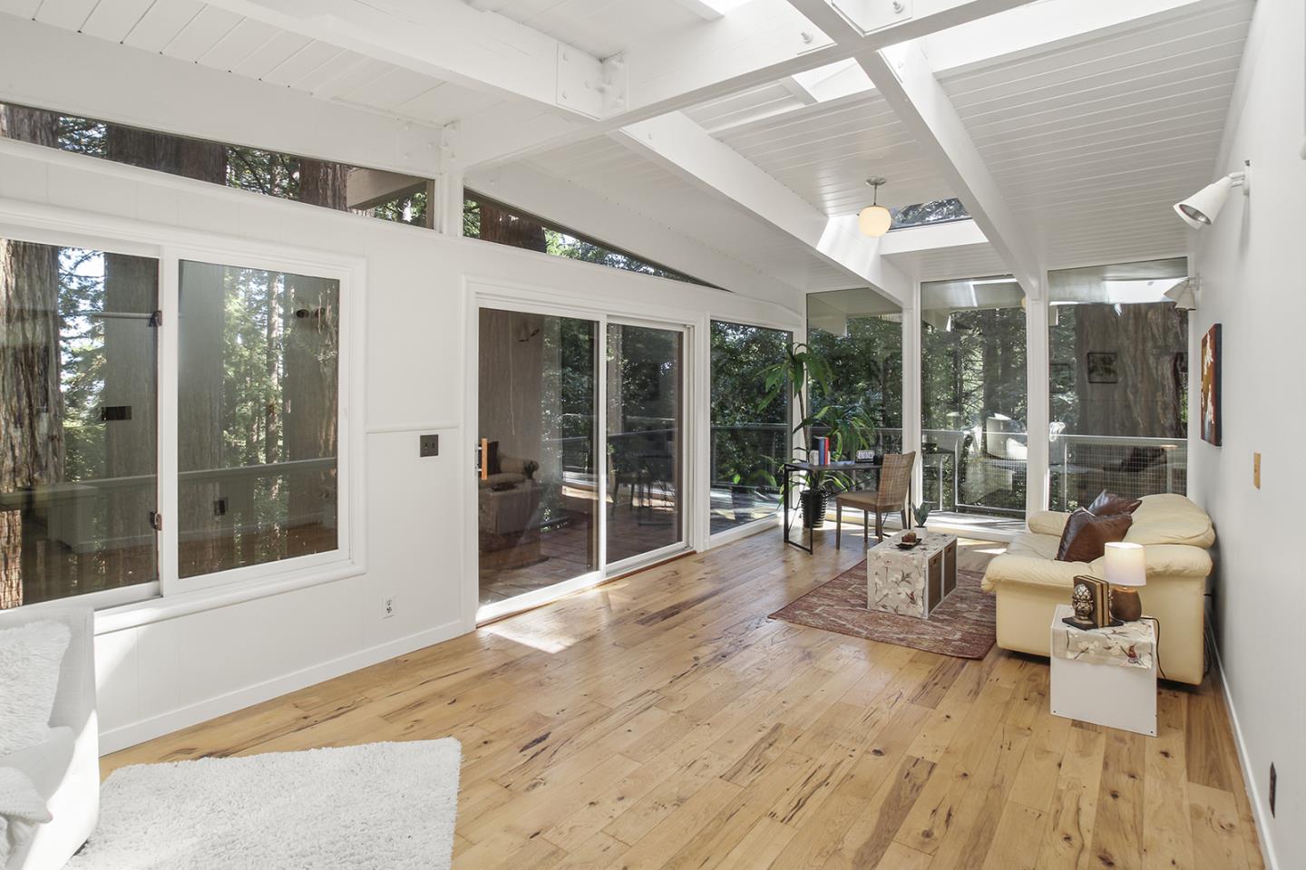 320 Grandview Drive Woodside, CA 94062 - Photo 17 of 43 a large room with wooden floor and furniture