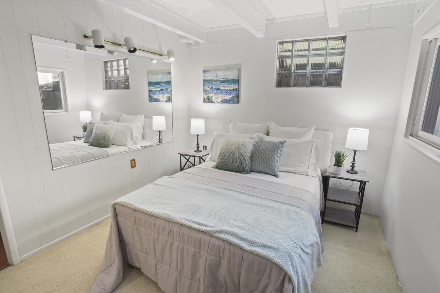 320 Grandview Drive Woodside, CA 94062 - Photo 27 of 43 a bedroom with a large bed and a window