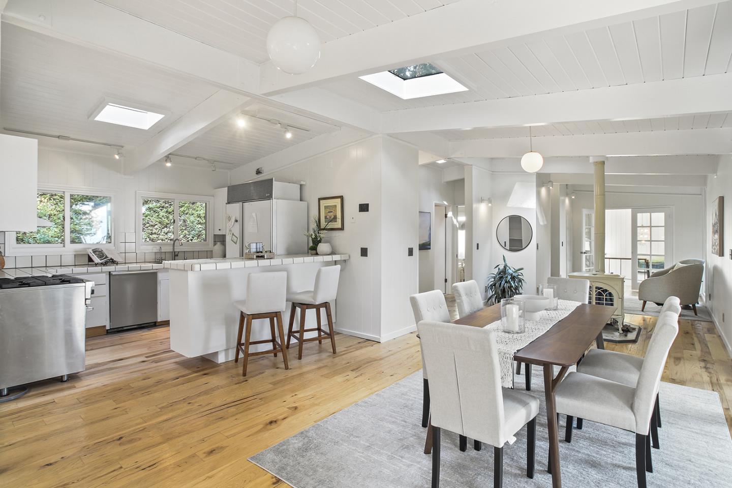 320 Grandview Drive Woodside, CA 94062 - Photo 3 of 43 a dining room with stainless steel appliances kitchen island granite countertop a dining table chairs and view living room
