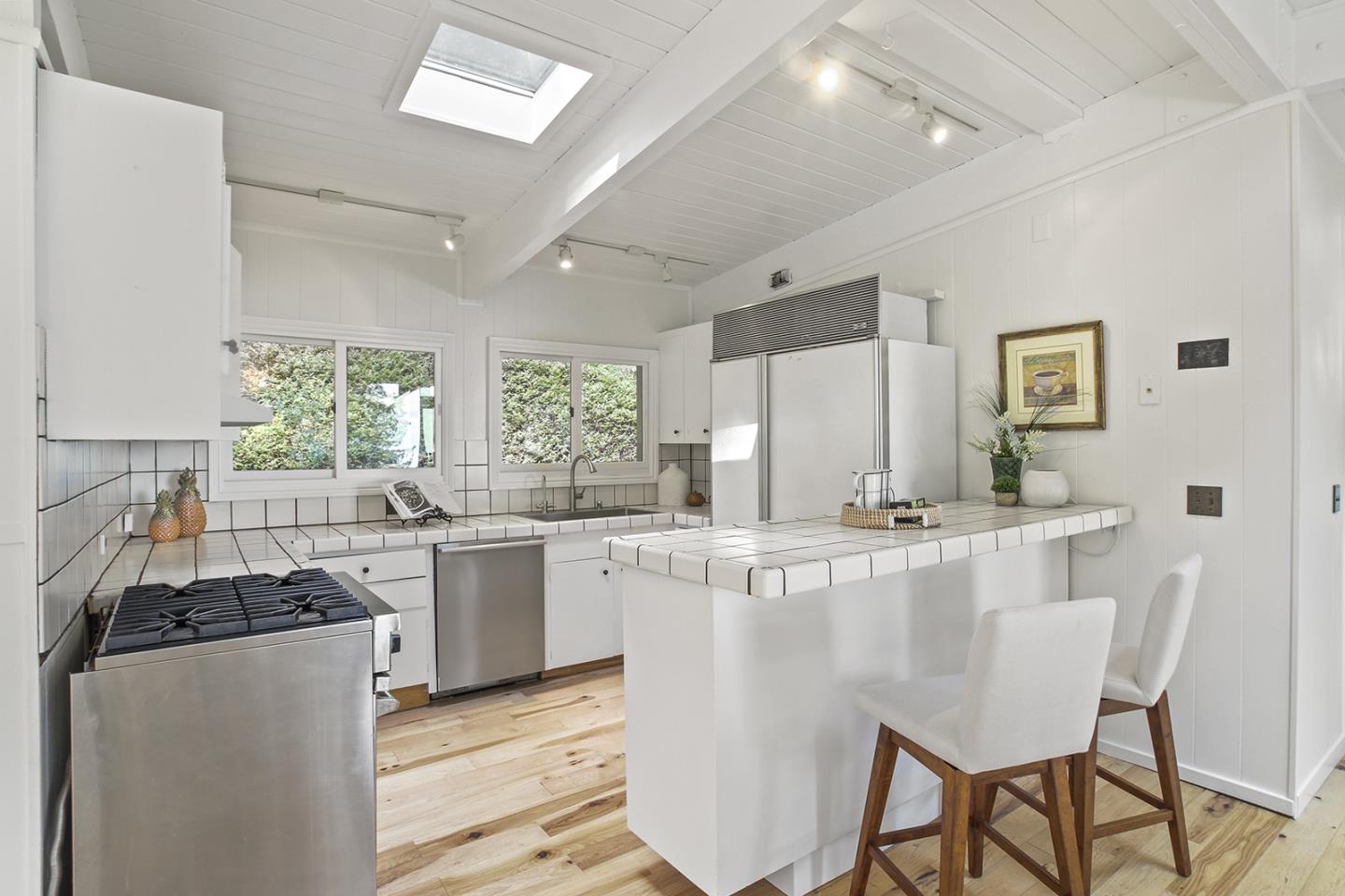 320 Grandview Drive Woodside, CA 94062 - Photo 4 of 43 a kitchen with appliances a sink and cabinets