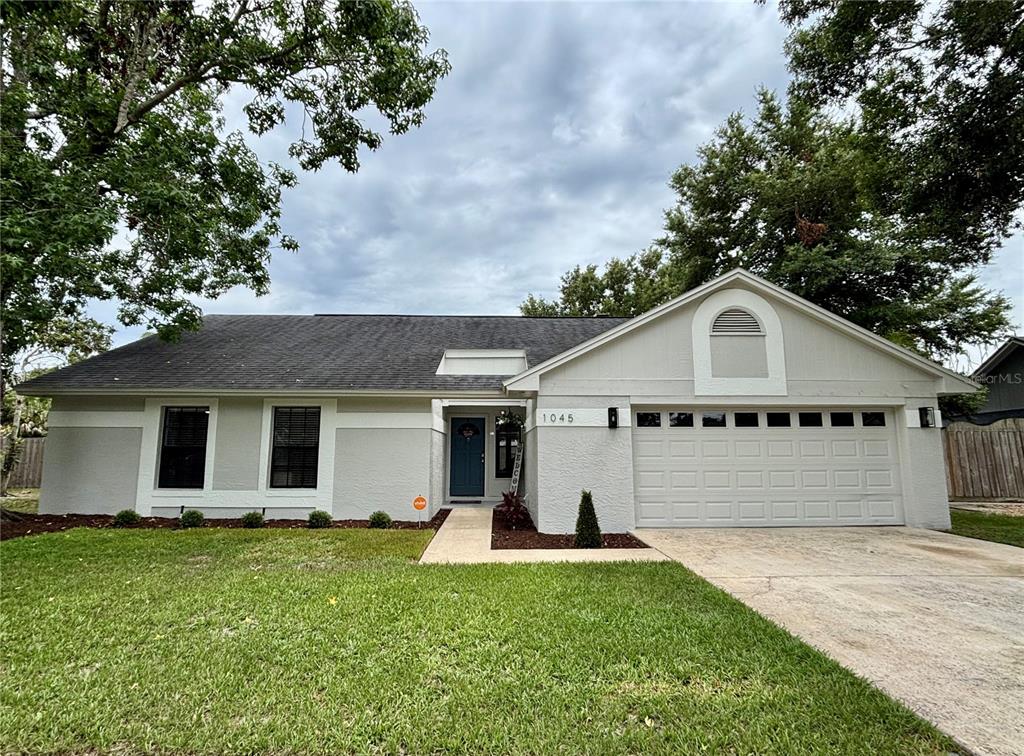 1045 Shaffer Trail Oviedo, FL 32765 - Photo 1 of 30 a view of a yard in front of house