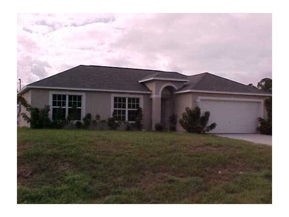 2450 Southeast Ralph Palm Bay, FL 32909 - Photo 1 of 8 a view of a yard in front of house