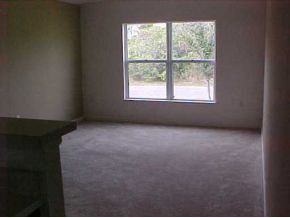 2450 Southeast Ralph Palm Bay, FL 32909 - Photo 2 of 8 an empty room with a window