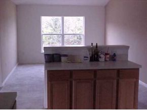 2450 Southeast Ralph Palm Bay, FL 32909 - Photo 6 of 8 a bathroom with a sink a mirror and a window