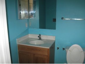 2450 Southeast Ralph Palm Bay, FL 32909 - Photo 7 of 8 a bathroom with a sink and mirror