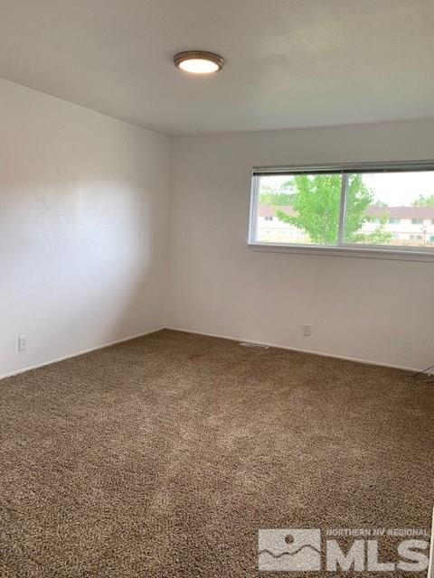 3675 Neil Road Reno, NV 89502 - Photo 5 of 6 an empty room with a window