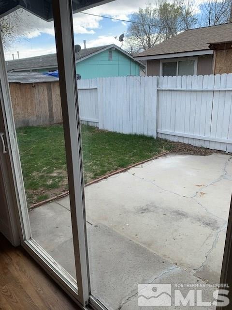 3675 Neil Road Reno, NV 89502 - Photo 6 of 6 a view of backyard with small cabin and wooden fence