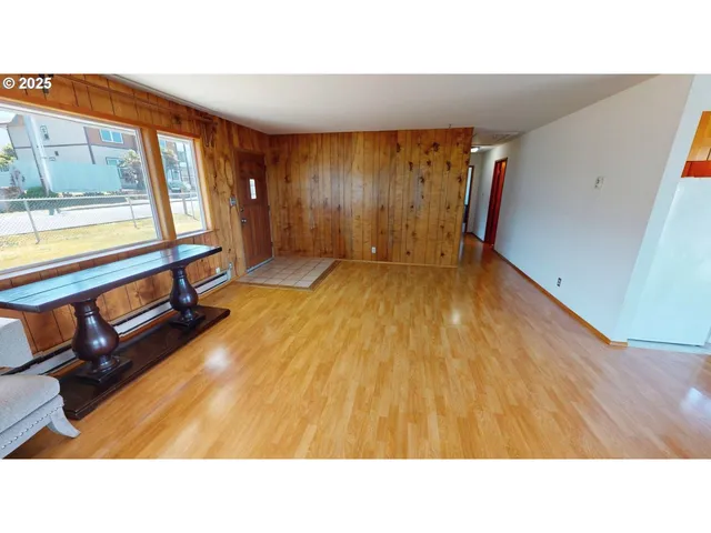 a living room with a couch and large window
