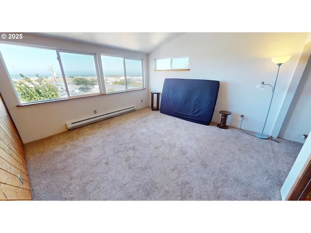 a black and white photo of a living room