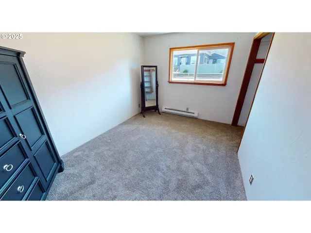 a open area with furniture and a window