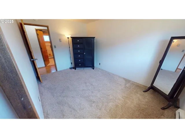 a open living room with furniture and a mirror