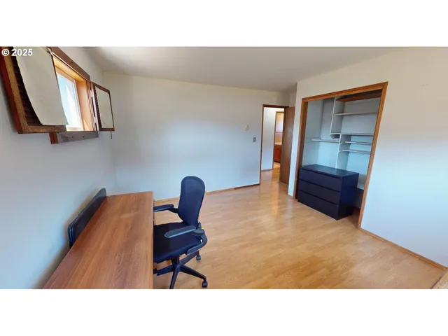a living room with furniture and a chair
