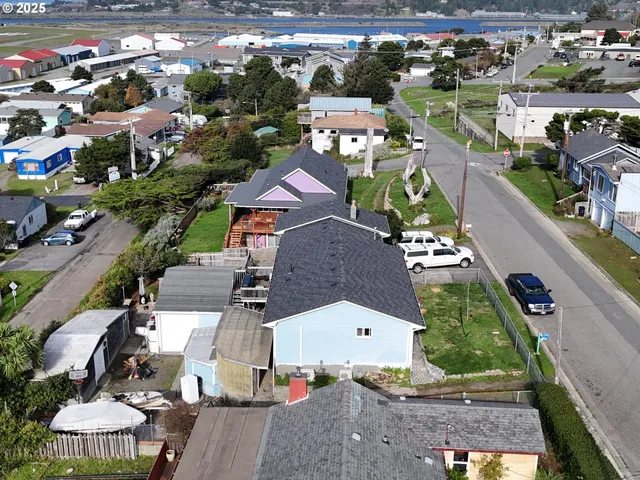 an aerial view of a house with yard swimming pool and outdoor seating