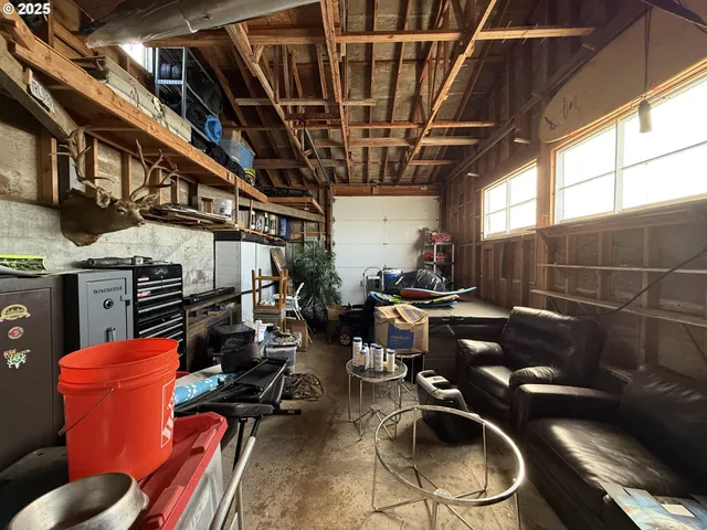 a view of gym equipment with wooden floor