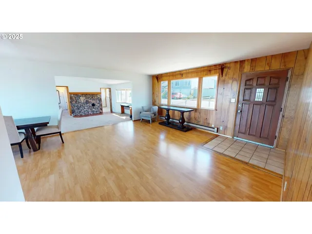 a room with furniture and a large window