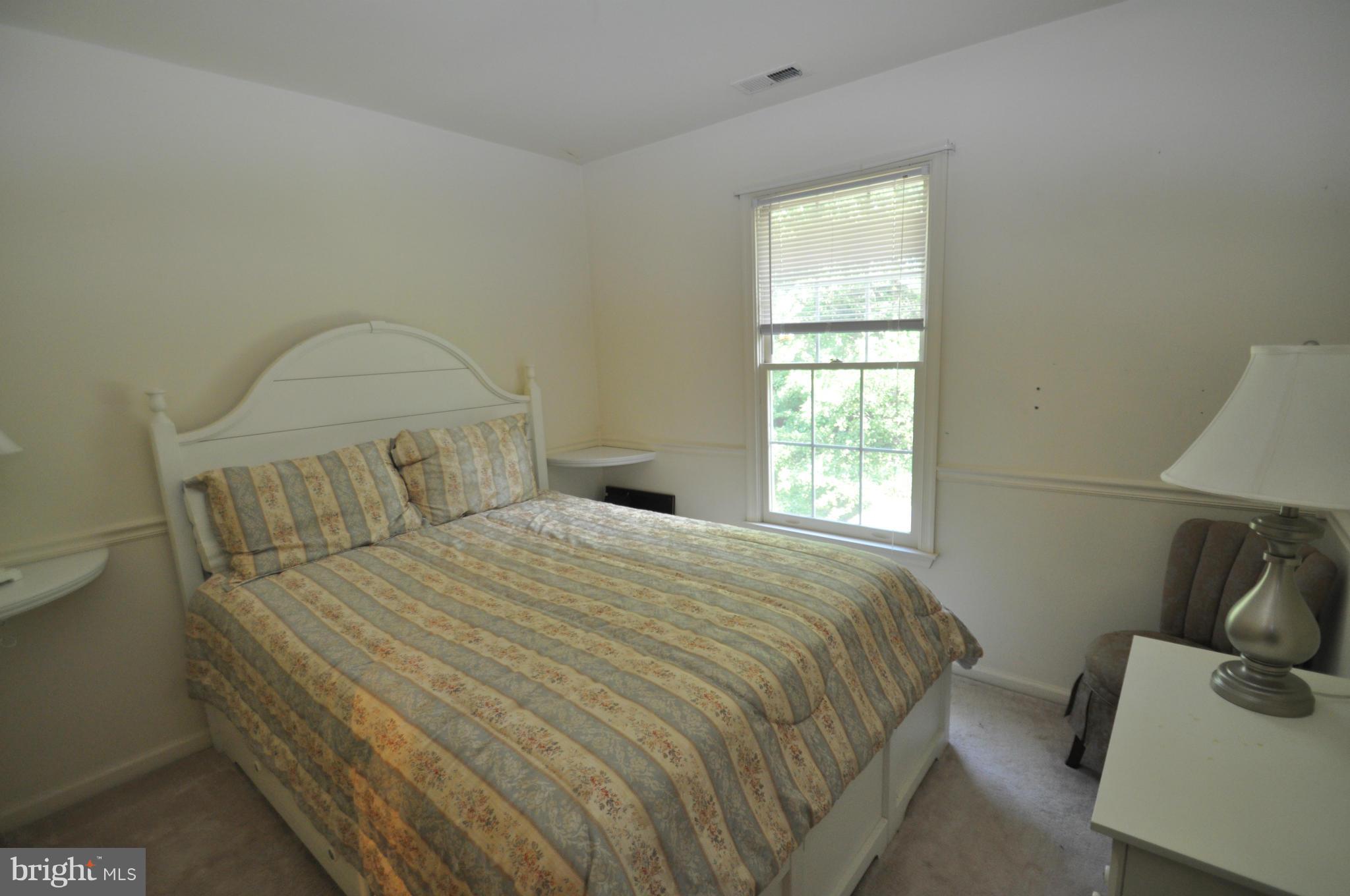 1109 Oak View Drive Mount Airy, MD 21771 - Photo 12 of 18 a bedroom with a bed and a window