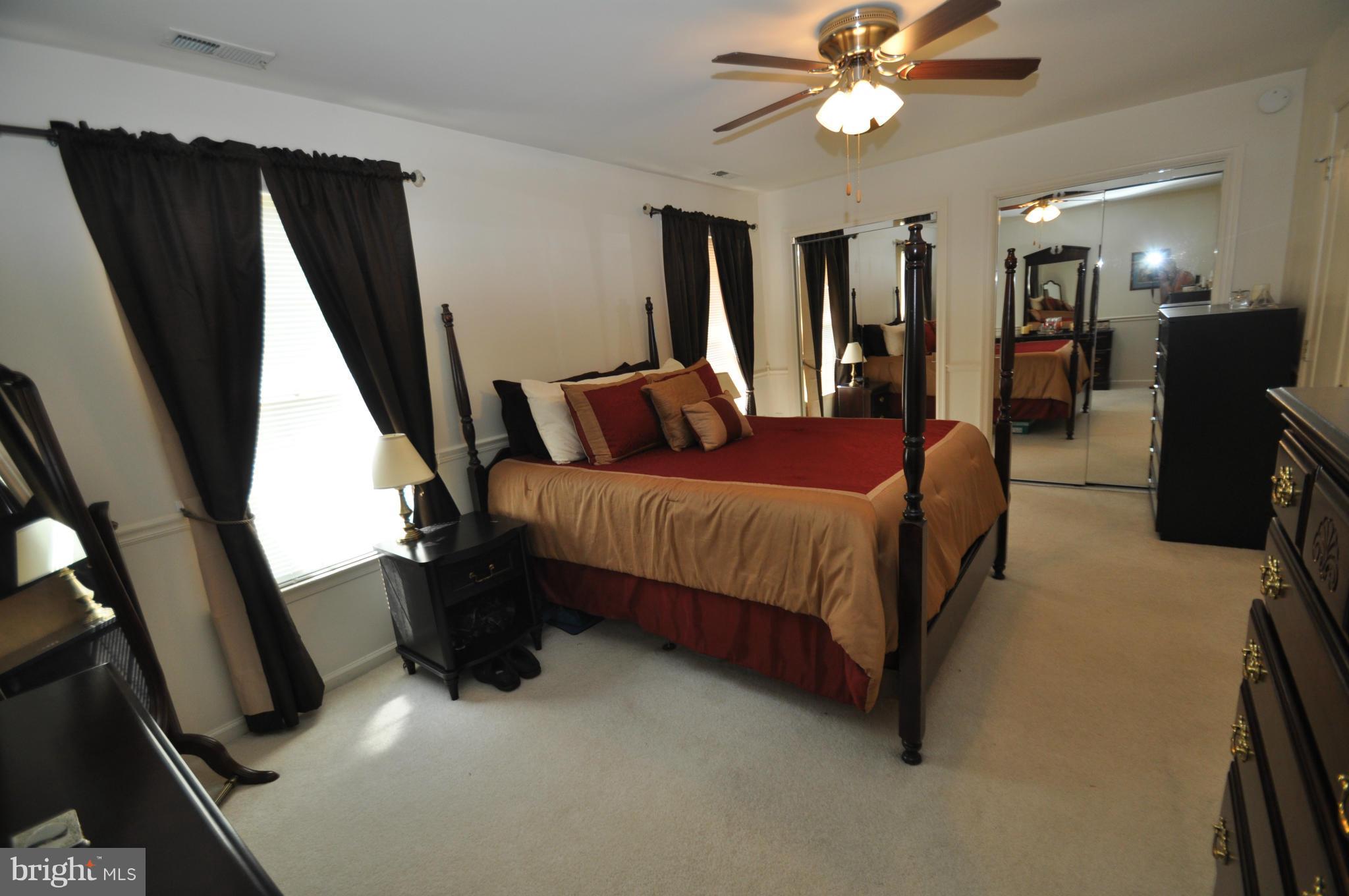 1109 Oak View Drive Mount Airy, MD 21771 - Photo 9 of 18 a bedroom with a bed window and a chandelier
