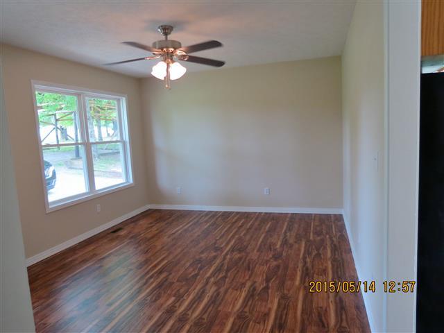3851 Waverly Road Tennessee Ridge, TN 37178 - Photo 2 of 20 Living room with laminate flooring, new replacement windows throughout.