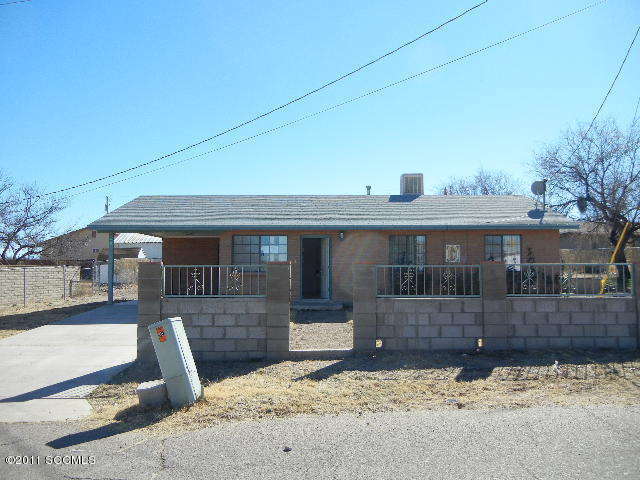 423 Gorrion Court, Unit CORTE Rio Rico, AZ 85648 - Photo 1 of 1 a front view of a house with a yard