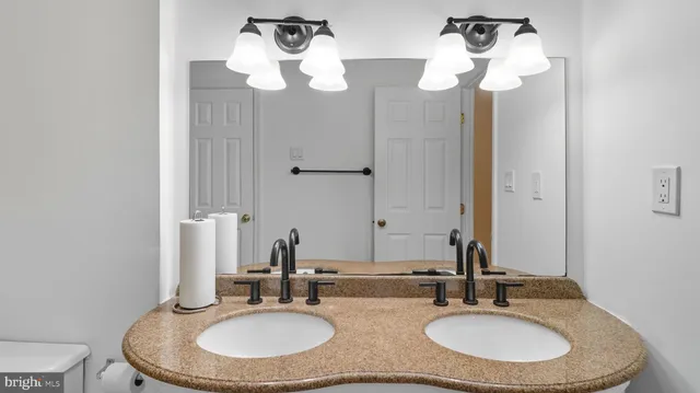 an empty room with wooden floor and a window