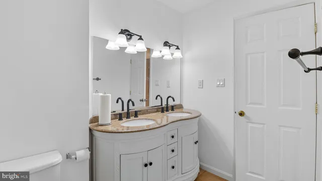 a view of an empty room with a window and a ceiling fan