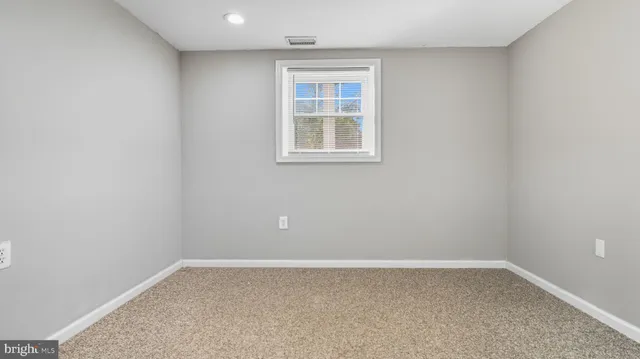 a view of a roof deck with wooden floor and fence