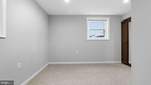 a view of a porch with furniture and backyard