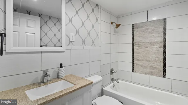 a view of a dining room with furniture and window