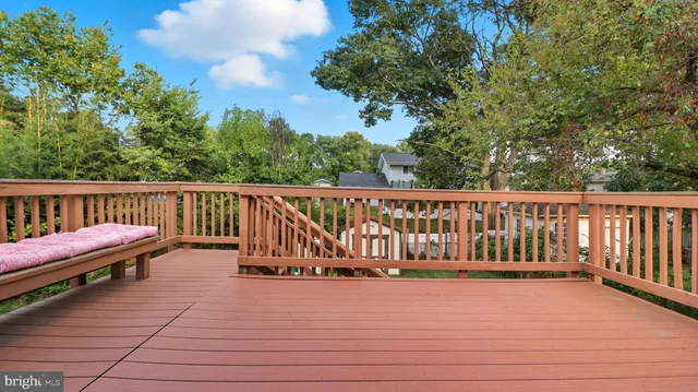 a living room with furniture fireplace and a large window