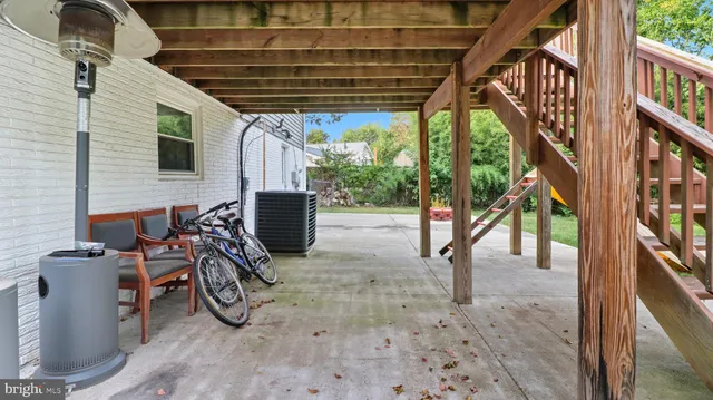 a bedroom with a bed and a potted plant