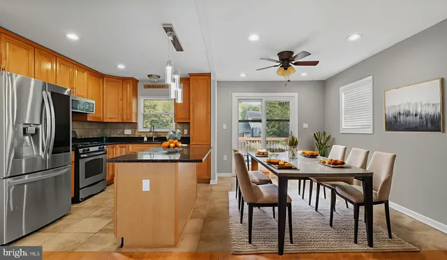 a bedroom with a bed and a potted plant