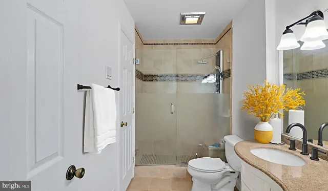 a bedroom with a bed and a potted plant