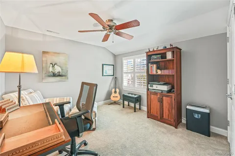 a work room with furniture and a window
