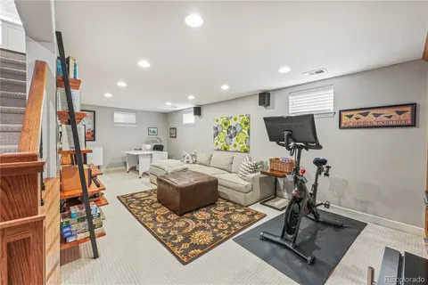a living room with furniture and a rug