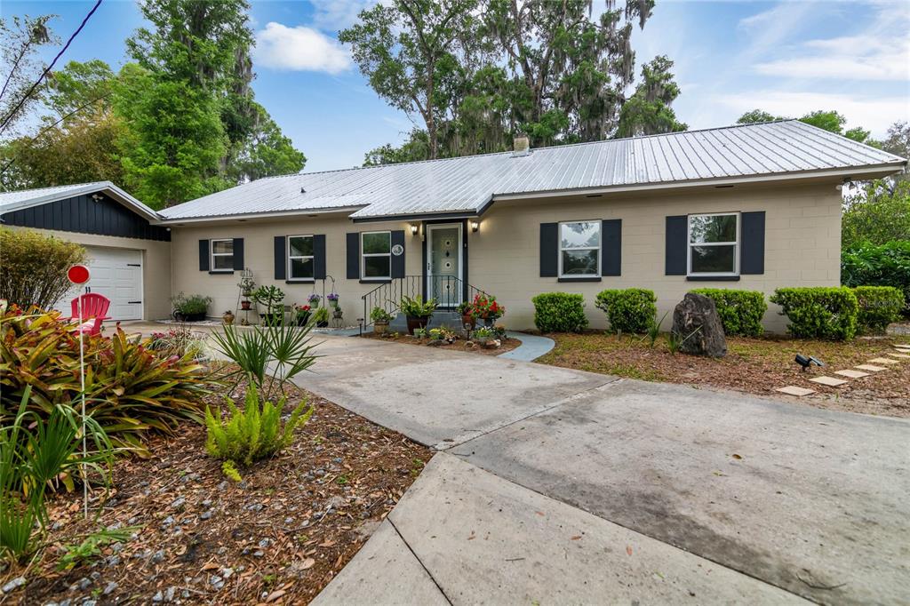 1951 Van Cleef Road DeLand, FL 32720 - Photo 1 of 1 a front view of house with yard outdoor seating and barbeque oven