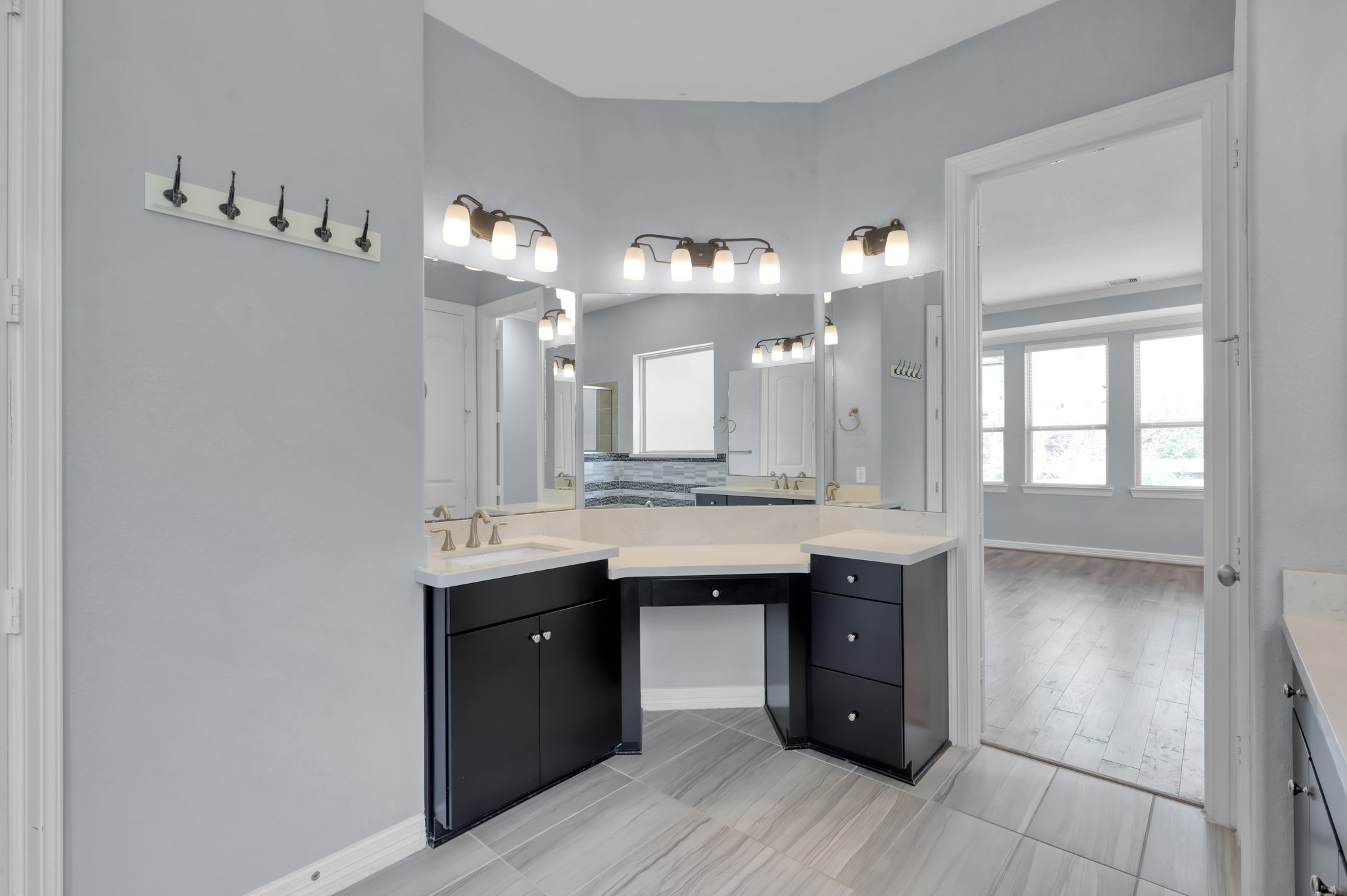 23219 Belted Kingfisher Trail Spring, TX 77389 - Photo 18 of 43 a large bathroom with a granite countertop double vanity sink and a mirror
