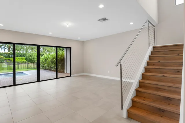 a view of an entryway with wooden floor
