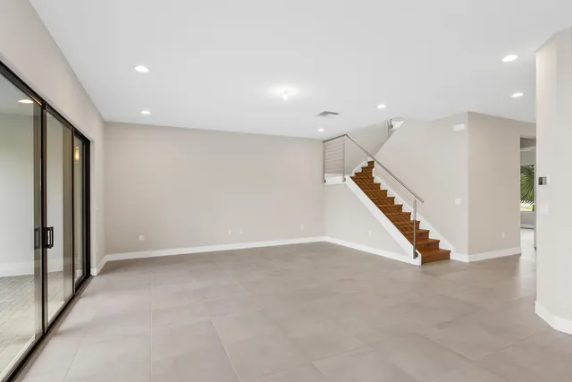 an entryway in a hall hall with a large window