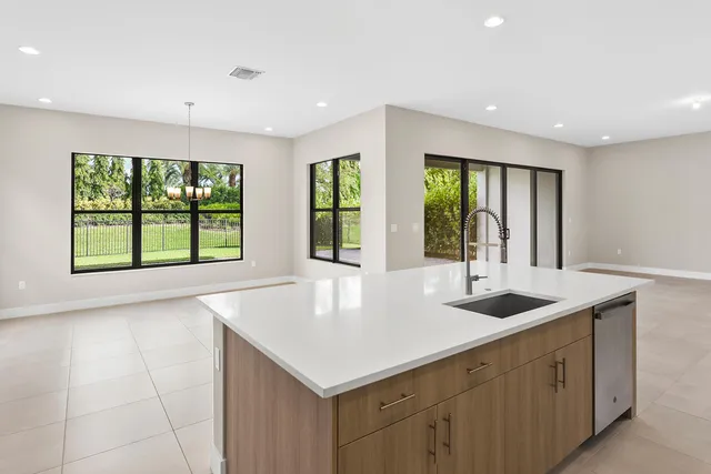 a kitchen with a sink and large window