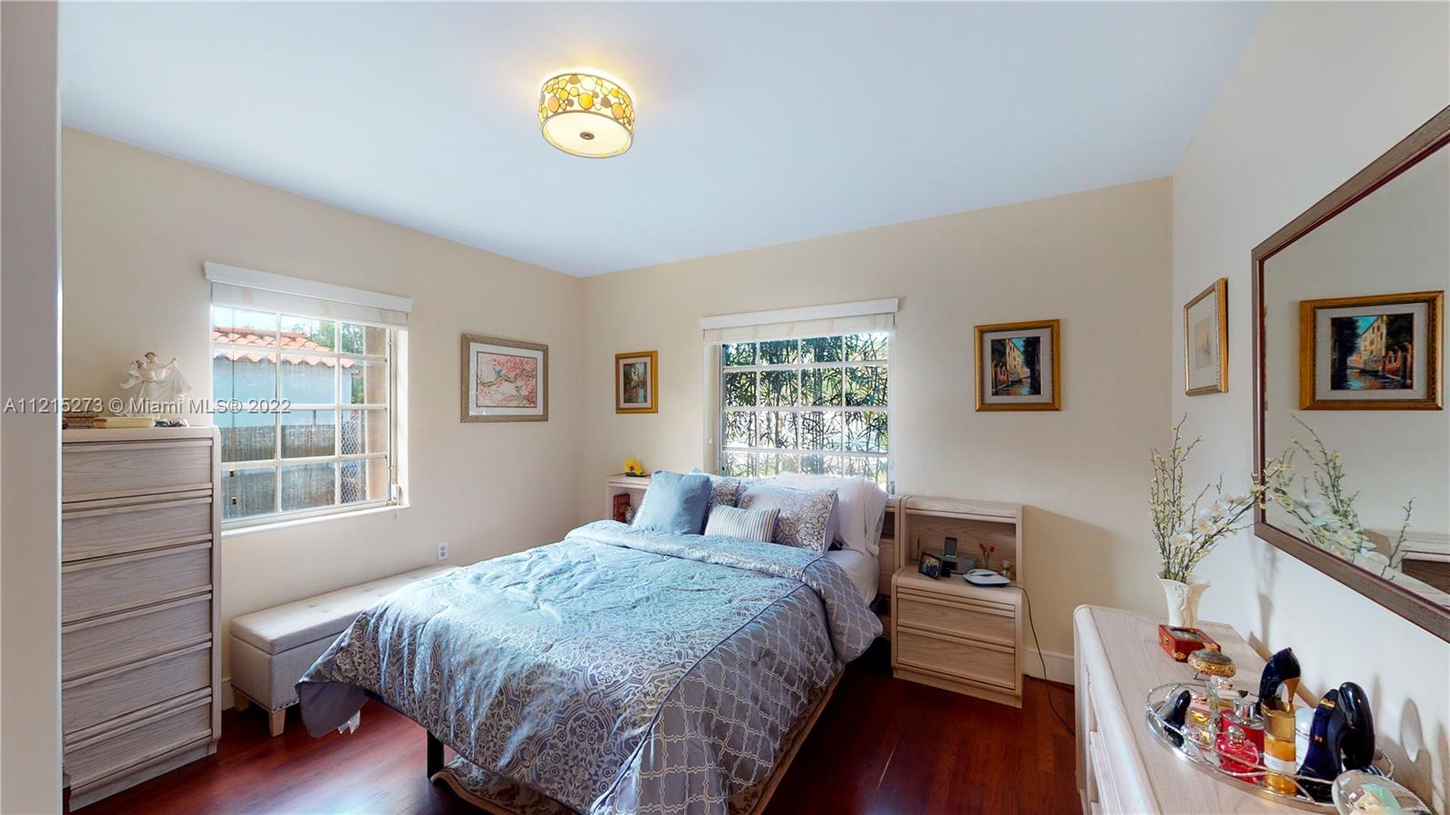 619 Southwest 20th Road Miami, FL 33129 - Photo 11 of 25 a bedroom with a bed and a window