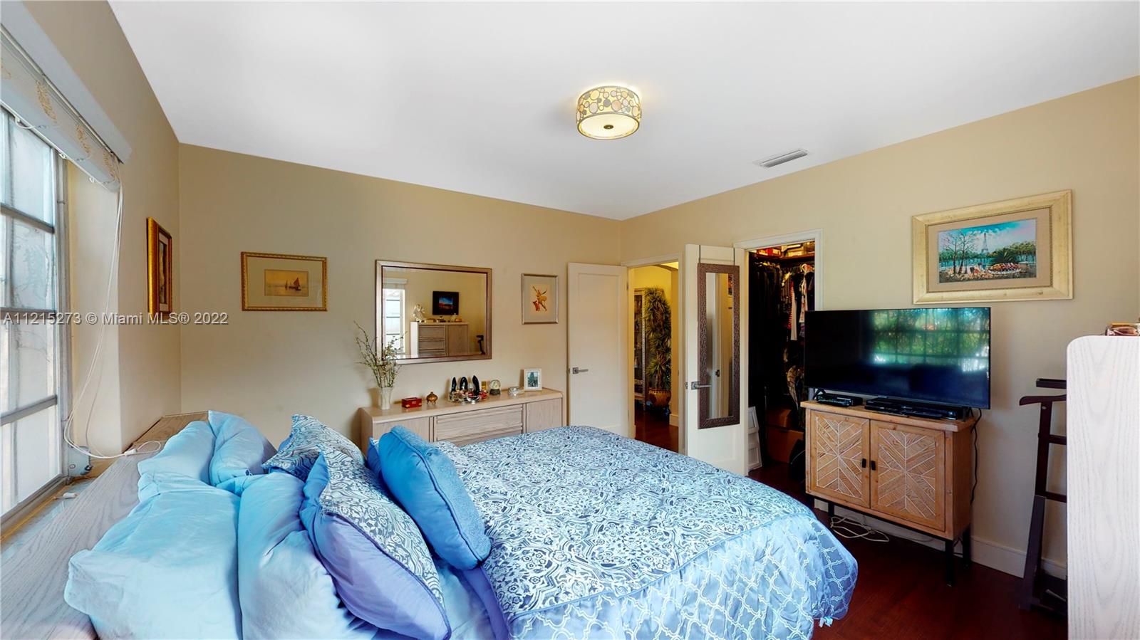 619 Southwest 20th Road Miami, FL 33129 - Photo 12 of 25 a bedroom with furniture and a flat screen tv
