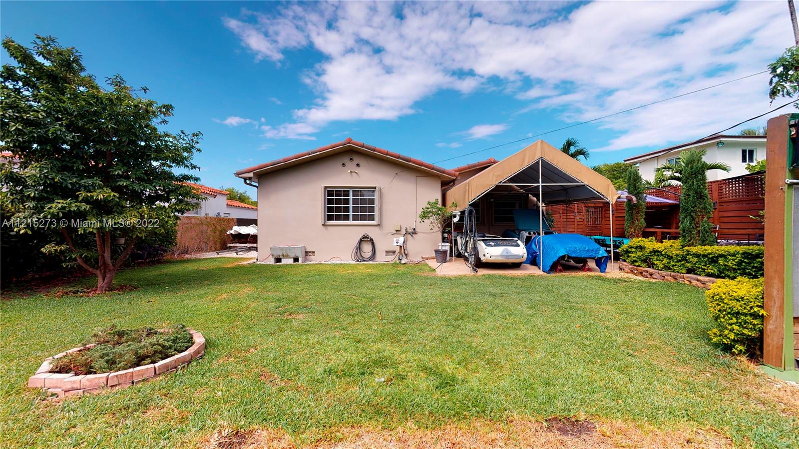 619 Southwest 20th Road Miami, FL 33129 - Photo 20 of 25 a front view of a house with a garden