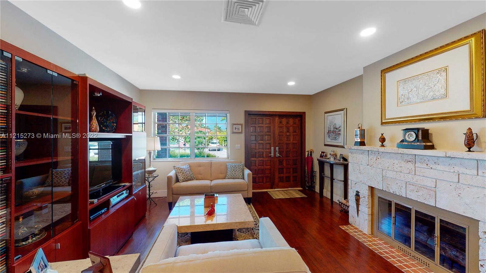 619 Southwest 20th Road Miami, FL 33129 - Photo 7 of 25 a living room with furniture fireplace and flat screen tv