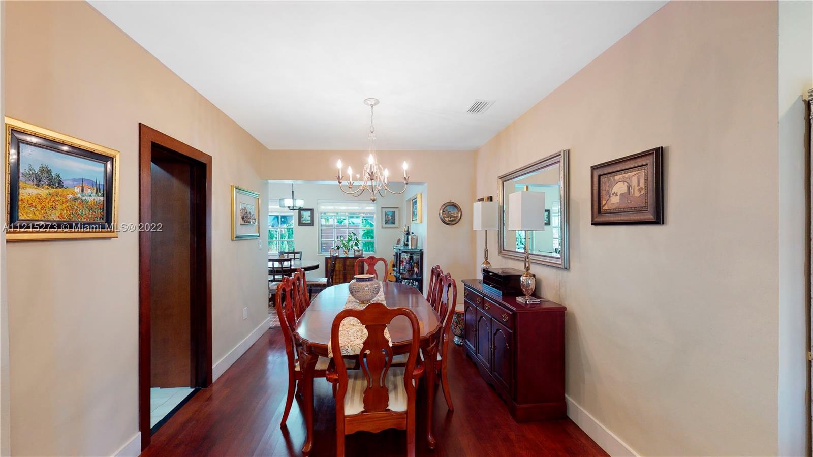619 Southwest 20th Road Miami, FL 33129 - Photo 9 of 25 a view of a dining room with furniture and wooden floor