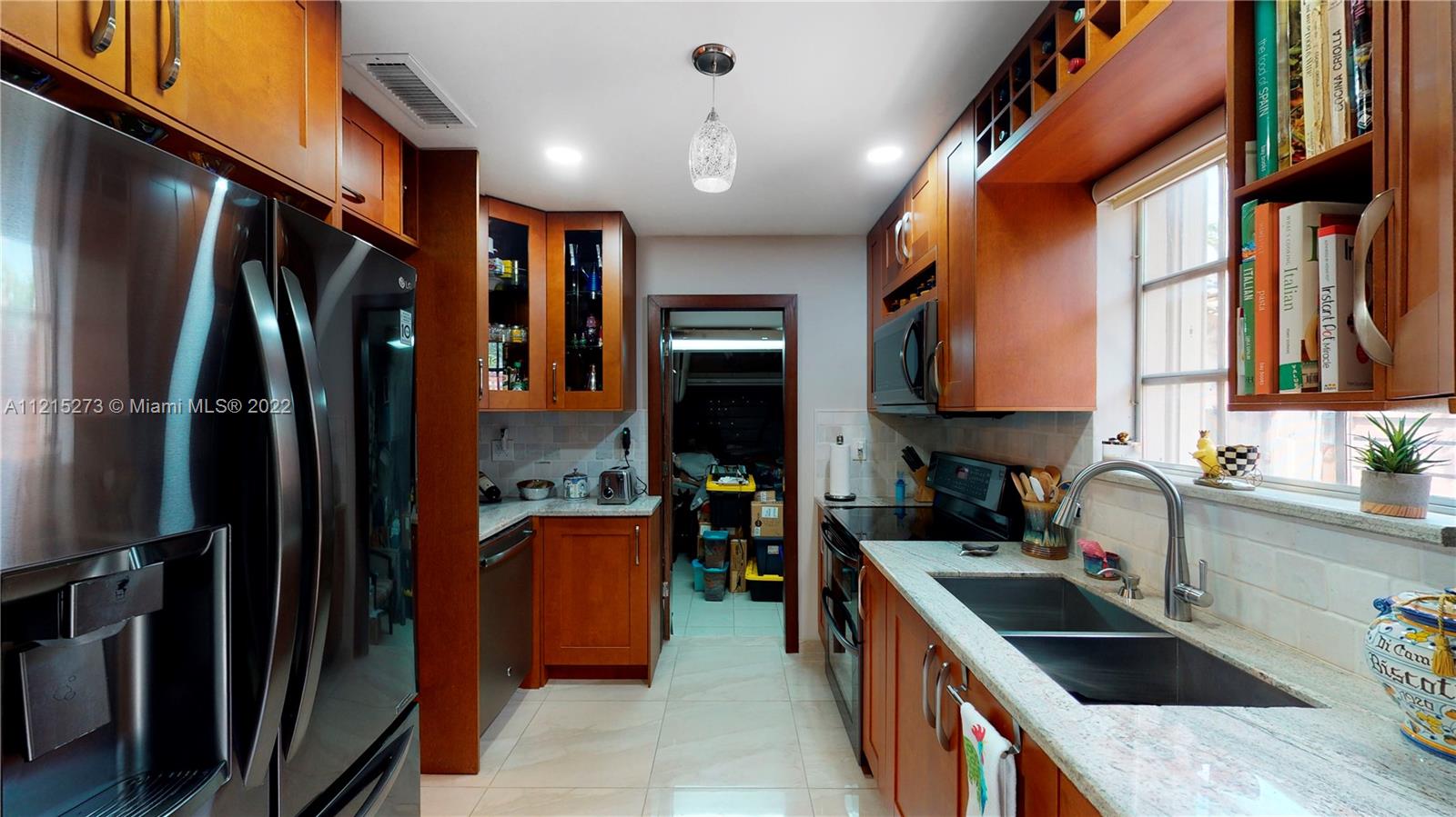 619 Southwest 20th Road Miami, FL 33129 - Photo 10 of 25 a kitchen with stainless steel appliances granite countertop a refrigerator a sink dishwasher a stove and a refrigerator